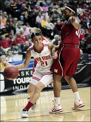 Ohio State's Samantha Prahalis drives around Nebraska's Rebecca Woodberry. Prahalis had 23 points for the Buckeyes.