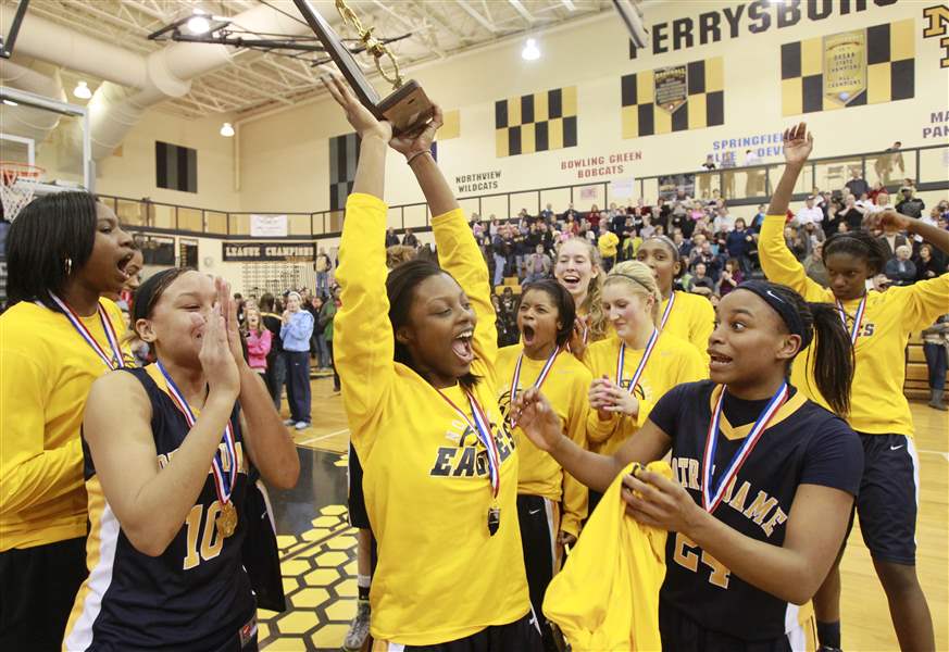 Notre-Dames-Talajha-Parker-raises-the-girls-Division-I-district-basketball-championship-trophy