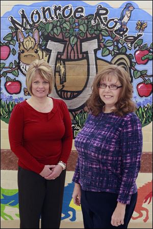 Regina Whalen, left, and Amy Driehorst, shown at Monroe Road Elementary, are being applauded by Bedford Schools officials for their initiative to raise funds.