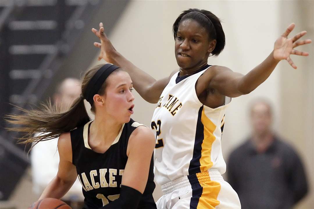 Notre-Dame-s-Michelle-Holmes-32-defends-against-Perrysburg-s-Taylor-Knight