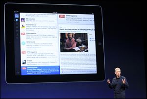 Apple CEO Tim Cook introduces the new iPad during an event Wednesday in San Francisco.