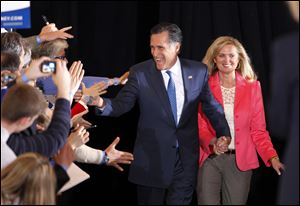 Former Massachusetts Gov. Mitt Romney and his wife, Ann, greet supporters as they arrive at their Super Tuesday rally in Boston. Mr. Romney placed first in the GOP primary in the critical battleground state of Ohio.
