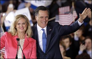 Republican presidential candidate, former Massachusetts Gov. Mitt Romney and his wife Ann wave to supporters at his Super Tuesday campaign rally in Boston.