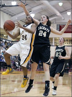 Notre Dame's Michelle Holmes (32) defends against Perrysburg's Taylor Knight (13) Tuesday during a D-I girls regional semifinal.