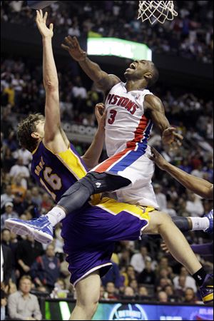 The Pistons' Rodney Stuckey, right, is fouled by the Lakers' Pau Gasol during overtime. Stuckey made both free throws to put the Pistons ahead for good as they won 88-85.