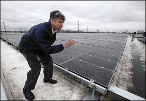 Granger Souder of Solscient Energy explains how the solar panels that his company installed on the roof of the General Motors plant on Alexis Road will work.