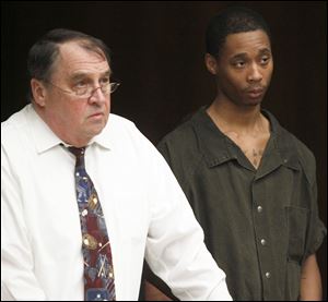 Kenneth Awls, 18, right, appears Friday in Toledo Municipal Court with defense lawyer Marty Dow.