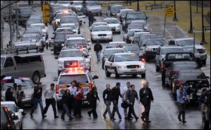 Police evacuate the Western Psychiatric Institute after the shooting. The University of Pittsburgh is on break, so few students were on campus. All injured were taken to the UPMC Presbyterian Hospital up the street.