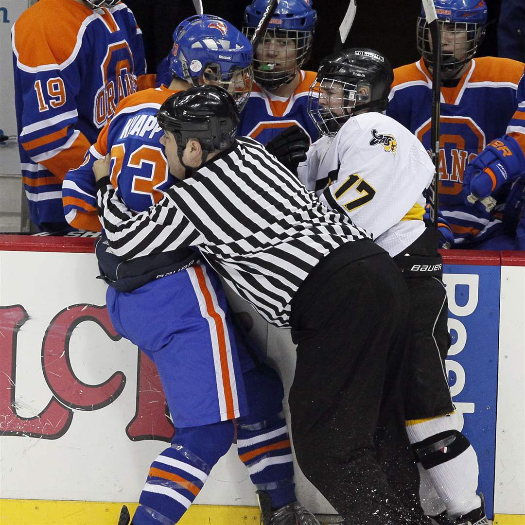 An-official-breaks-up-a-fight-between-Sylvania-Northview-s-Nick-LaPlante-17-and-Olentangy-Orange-s-Mitch-Knapp