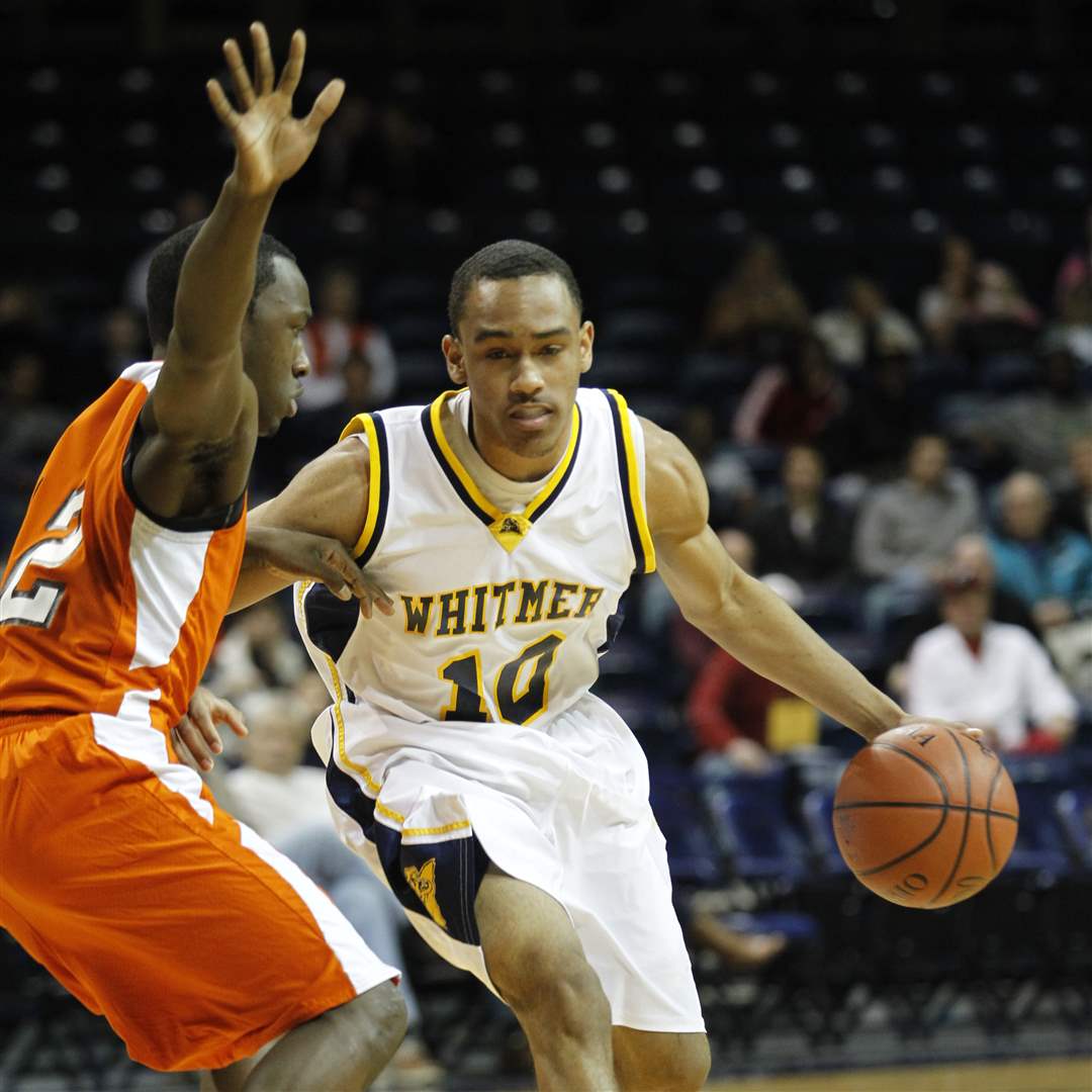 Whitmer-High-School-player-Ricardo-Smith-10-drives-around-Sylvania-Southview-player-Chris-Johnson-12