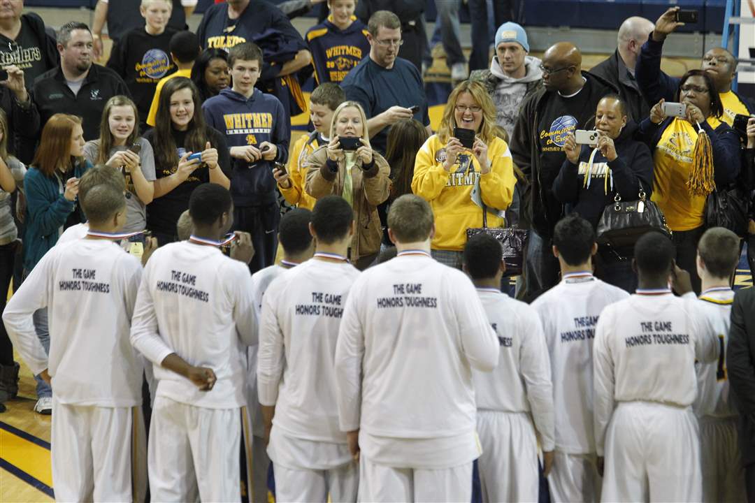 Whitmer-High-School-fans-take-photos-of-the-winning-Panthers