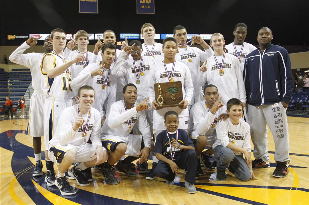 Whitmer-High-School-players-celebrate-with-their-trophy