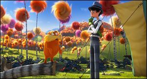 The Lorax, voiced by Danny Devito, left, and Once-ler, voiced by Ed Helms, are shown in a scene from 