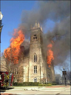 Flames shoot out of the windows at First United Methodist Church in Ada, Ohio.