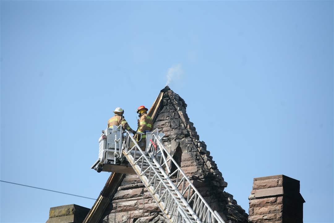 Firefighters-inspect-the-burned-out-church-in-Ada-OH