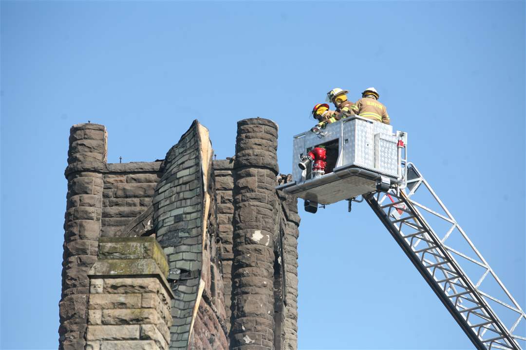 Firefighters-inspect-the-burned-out-church