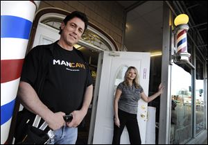 At Cahill Salon & Barber Parlor in the St. Paul suburb of Rosemount, Minn., husband and wife owners Joel and Lisa Martin differ on barber pole legislation. He likes the proposed limits; she does not.