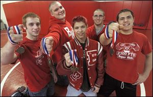 Bedford wrestlers who competed at the state individual tournament were, from left, Al Regnier, Logan Rimmer, Mitchel Rogaliner, Brandon Sunday, and Bryan Smith. Rogaliner won the title at 112 pounds. He won the championship at 103 as a freshman and was runner-up at 103 last season. Rimmer and Sunday finished runners-up.