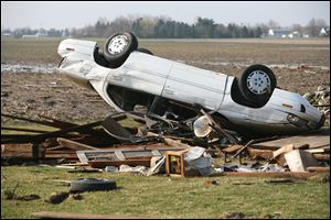 One of the Montris’ sedans was overturned when the twister touched down on their Ida-area farm Thursday night.