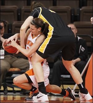 Bowling Green's Chrissy Steffen, left, battles Virginia Commonwealth's Chelsea Snyder for the ball Thursday night at the Stroh Center. The Falcons saw their season end with a record of 24-7.