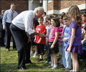 Vice President Joe Biden greets students outside Glenwood School in Rossford. About 20 students stood outside to greet Mr. Biden during his visit to the area on Thursday. 