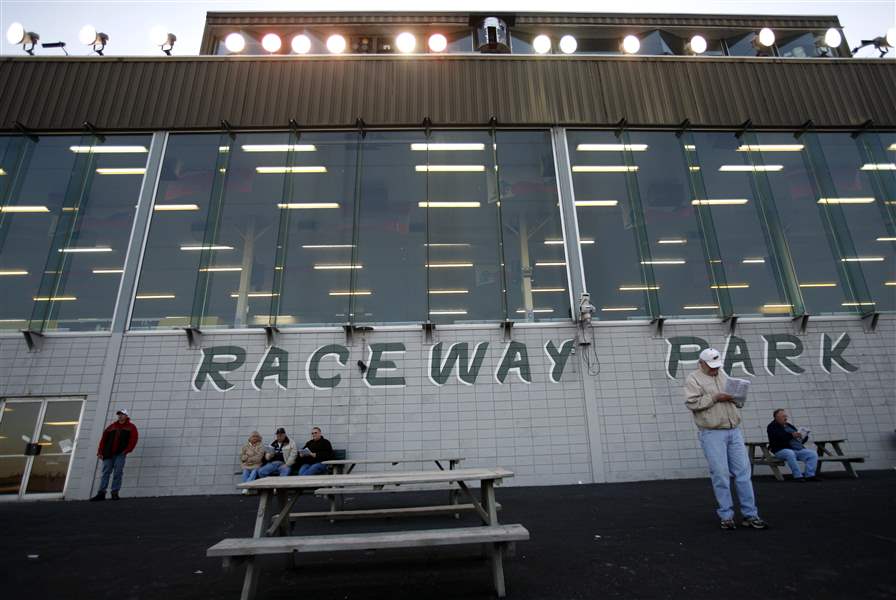 Harness-racing-betters-watch-the-races-outside-of-Raceway-Park