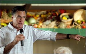 Republican presidential candidate former Massachusetts Gov. Mitt Romney addresses an audience during a campaign stop at a restaurant in Rockford, Ill., Sunday. Mr. Romney won in Puerto Rico convincingly.