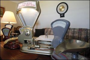 A collection of refurbished vintage scales in the home of Peter Kern.