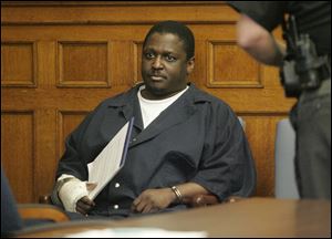 Wayne Powell awaits sentencing in Common Pleas Court Sept. 13, 2007. Convicted of aggravated murder and aggravated arson, he received four death sentences for a fire that killed four members of a family at 814 St. John Ave. in 2006.