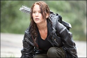 Jennifer Lawrence portrays Katniss Everdeen in a scene from 'The Hunger Games.'