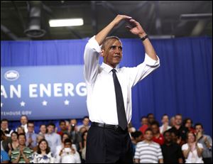 President Barack Obama starts the traditional O-H-I-O cheer after speaking at The Ohio State University in Columbus.