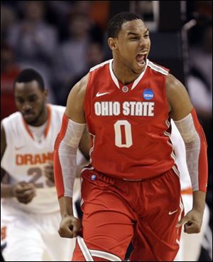 Ohio State forward Jared Sullinger (0) reacts in front of Syracuse forward Rakeem Christmas, left, during the first half of the East Regional final game.