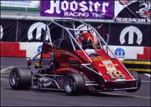 Austin Nemire, then 11, of Sylvania, drives a quarter midget racing car.
