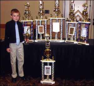 Austin Nemire has won several trophies in quarter midget racing. 