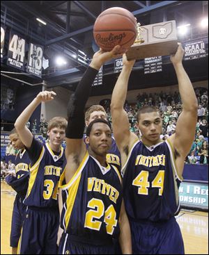 Whitmer’s LeRoy Alexander (24) and Chris Wormley (44) lead a
celebration after winning a Division I regional championship.