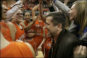 Curt Miller celebrates with the Falcons after an NCAA tournament victory over Vanderbilt in 2007. With the win, the Falcons became the only MAC women's basketball team in history to advance to the Sweet Sixteen. Miller's record with the Falcons is 258-92.