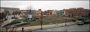 An empty lawn is all that is left in the space once occupied by the Seneca County Courthouse in Tiffin, Ohio.