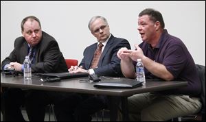 Dave Kielmeyer of Bowling Green State University, left, Brian Trauring of WTVG-TV, Channel 13, and Bill Gergich talk about the airing of a dash-cam video of the wrong-way crash that killed the driver and three BGSU students. The Press Club of Toledo presented the event.
