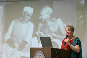 Sister Karen Elliott, a Mercy nun and theologian, describes to a group at Mercy College her observations from a recent trip to India.