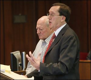 Gary Pinchoff, left, is sentenced for his animal cruelty conviction. His lawyer, William Godfroy, is with him. 