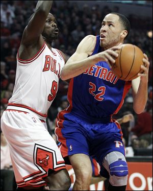 The Pistons' Tayshaun Prince looks to get off a shot against the Bulls' Luol Deng. Prince scored 14, and Deng led all scorers with 20.