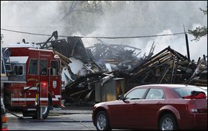 State and local fire and law enforcement officials are offering rewards for information leading to the person responsible for the Hidden Cedars Condominiums blaze, which killed two people and displaced 69 people. 