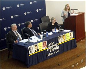 Barbara Blaine, founder of SNAP, speaks at the panel discussion as David Beckwith, left, Benjamin Davis, and Pam Spees listen. Ms. Blaine said her group expects a finding that the Pope and three other high-ranking Vatican officials were responsible for crimes committed by their subordinates. 