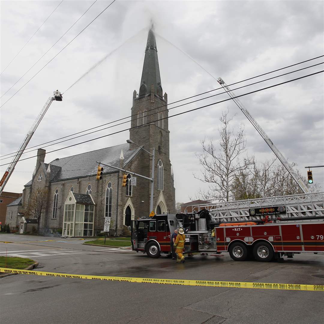 Firefighters-extinguish-a-fire-at-St-Rose-Church