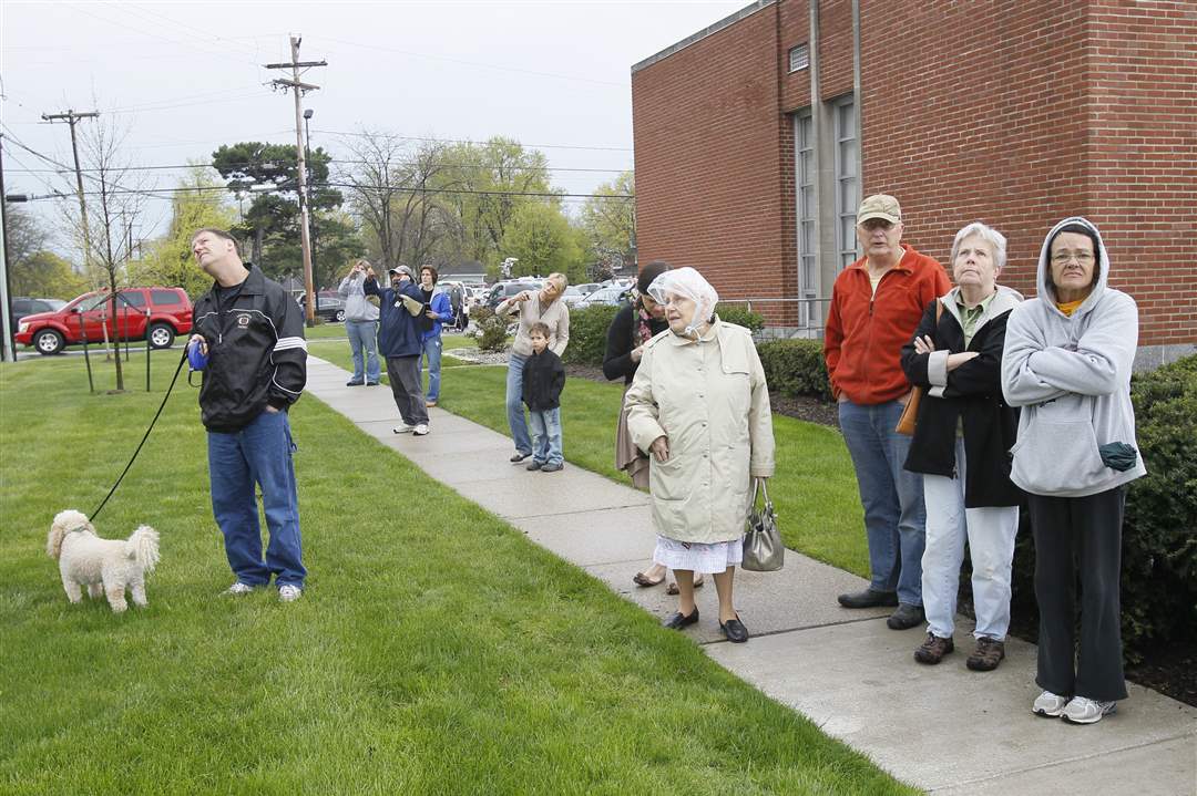 Spectators-watch-as-firefighters-put-out-a-fire-at-St-Rose-Church-in-Perrysburg