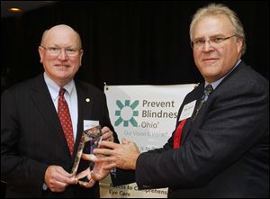 Honoree Gary Thieman, left, and host Mike Hylant at the People of Vision award dinner.