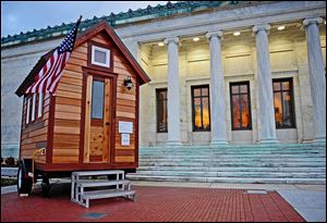 The Tumbleweed Tiny House, on the steps of the Toledo Museum of Art, was part of the Small Worlds exhibit at the museum.