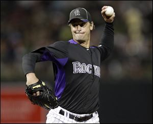 Jamie Moyer pitches for the Colorado Rockies this spring in an exhibition game.He recently won a spot on the Rockies' roster.