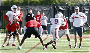 Ohio State Buckeyes head coach Urban Meyer watches his players during spring practice at Woody Hayes Athletic Center in Columbus Wednesday.