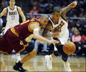 Milwaukee Bucks' Monta Ellis, right, steals the ball from Cleveland Cavaliers' Anthony Parker, left, during the second half the game Wednesday night.